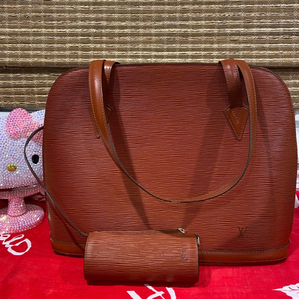 S O L D Authentic Louis Vuitton Epi Lusaac